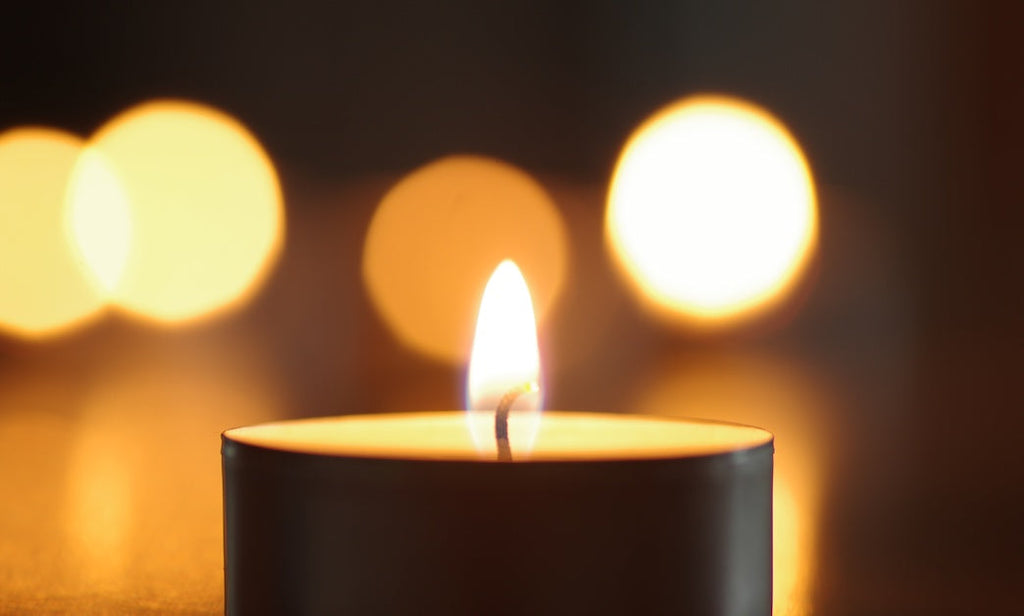 Metaphors for depression include the flickering candle: this is a close up photo of a flickering candle flame.