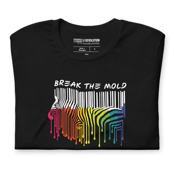 This is a photo of a Break the Mold t-shirt. In the middle of the t-shirt is a graphic of zebra in the silhouette of a barcode. The top half of the zebra are vertical white stripes, which then change just below the back into the colors of the rainbow. The bottom of each stripe has a paint drip mark. Just above the zebra's back is the phrase, in upper case, 'break the mold.' 