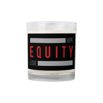 An Equity candle in a glass jar. On the outside of the jar is a black label. The word 'Equity' in upper case red letters is in the middle of the candle. Above and below the word are two thick rectangle blocks colored grey. The word HOPE is printed on the top right-hand side, and the word LOVE is on the bottom left side of the block.