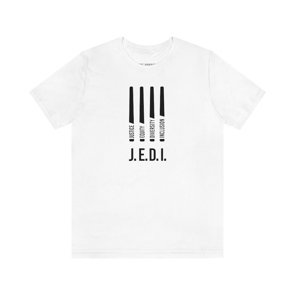 This is a photo of a white JEDI t-shirt. In the middle of the front of the JEDI t-shirt, are four black lightsabers. At the bottom of each saber representing the saber handle is one word: Justice Equity Diversity Inclusion. Beneath the sabers is the acronym JEDI in black upper case letters.