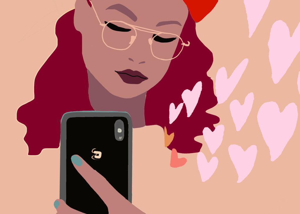 How selfish can I be? An illustration of a black woman with long red hair looking at their cell phone that is radiating love hearts.