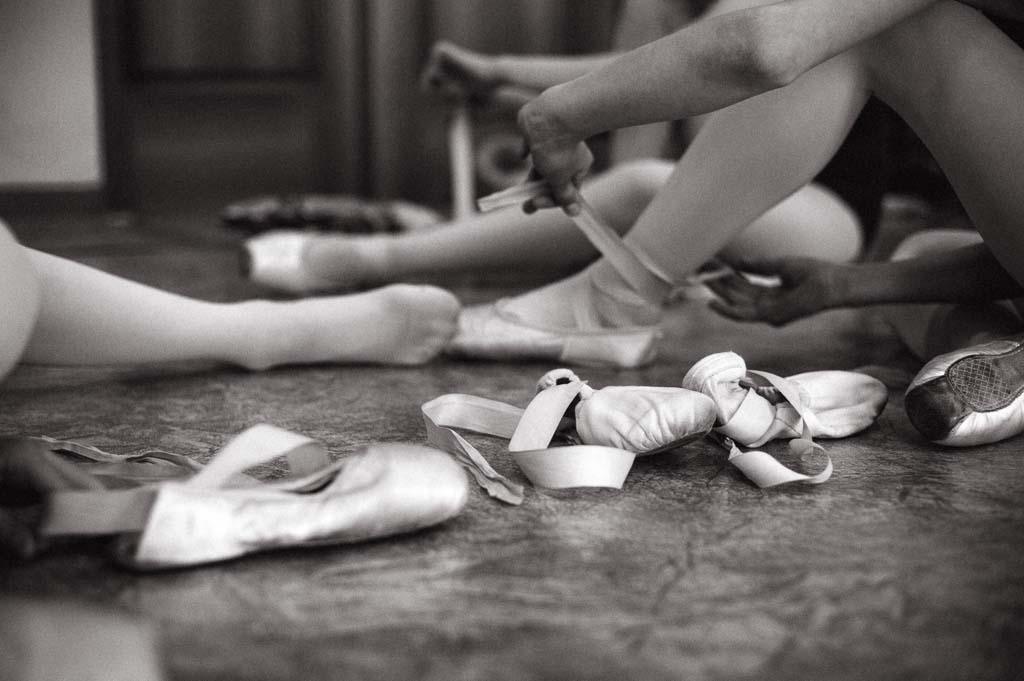 Young ballerina wearing pointe shoes. Close-up of a ballerina's