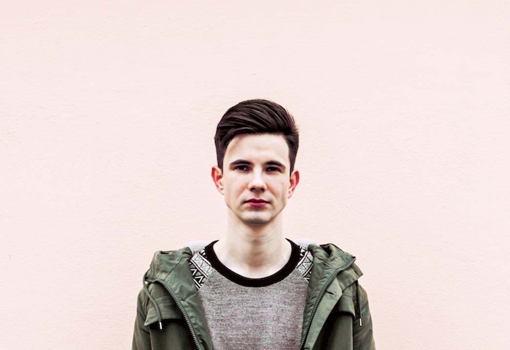 Disability and sexuality exploring the intimacy option: a young person stands looking isolated against a pink wall.