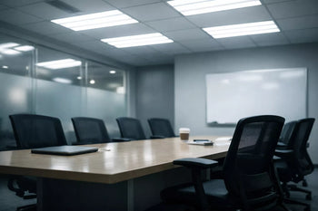 Harshly lit modern office space highlighting how everyday environments can be inaccessible for people with chronic illness