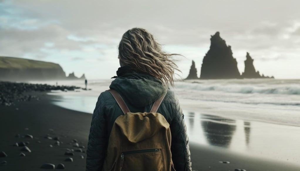 How writing helped me heal from heartbreak: an AI image of a person's back standing on a desolate beach.
