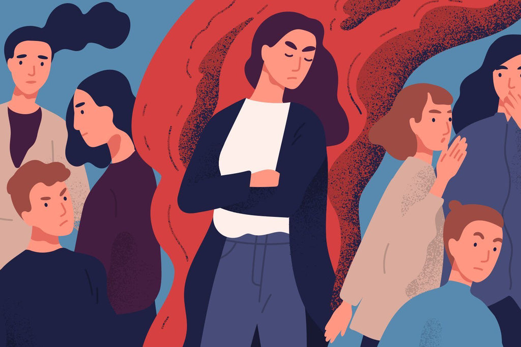 What to say to someone with autism? Illustration of a woman standing in the middle of other people but completely isolated, her arms folded defensively across her chest. To her left, three other people are talking about her.
