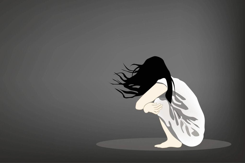 Illustration of a person alone on a floor, sad and depressed, for a psych ward stories article.