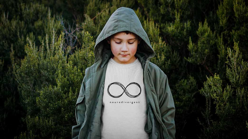A boy is standing outside wearing a hoodie. They are sad because their best school friend has cancer
