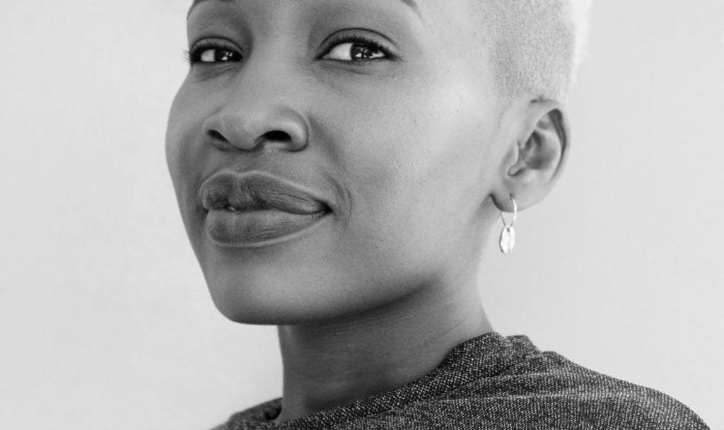 Image for article on counseling for cancer patients. Black and white photo of a middle-aged person with black skin and short-cropped white hair.
