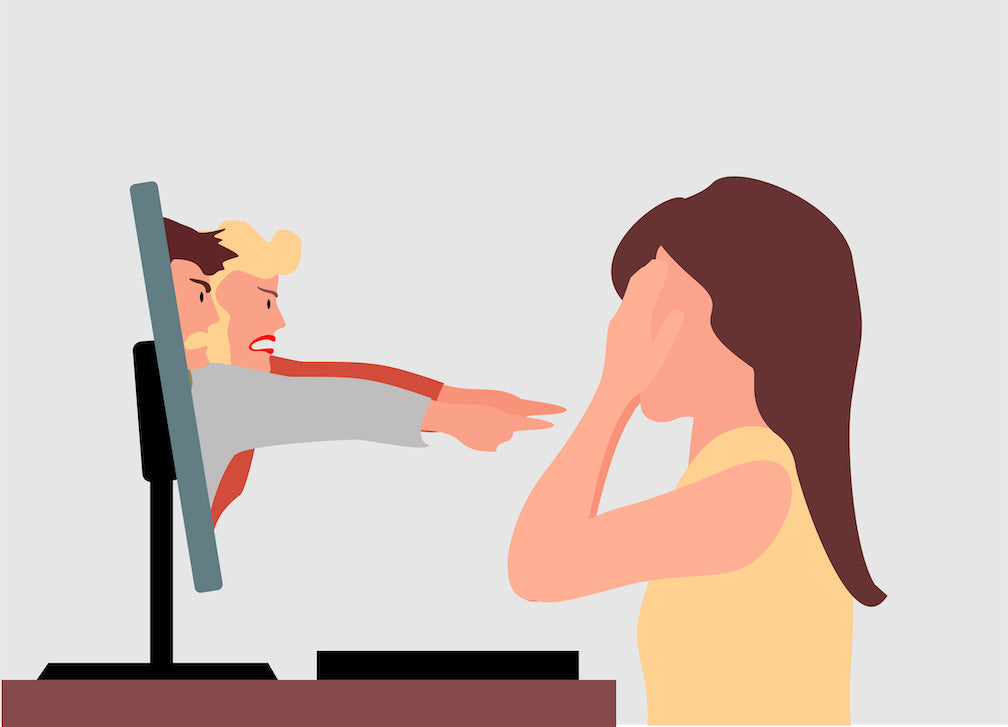 Illustration showing the pros and cons of social media on mental health: a woman is looking at their computer screen that has number of people pointing their fingers at her in a negative way.