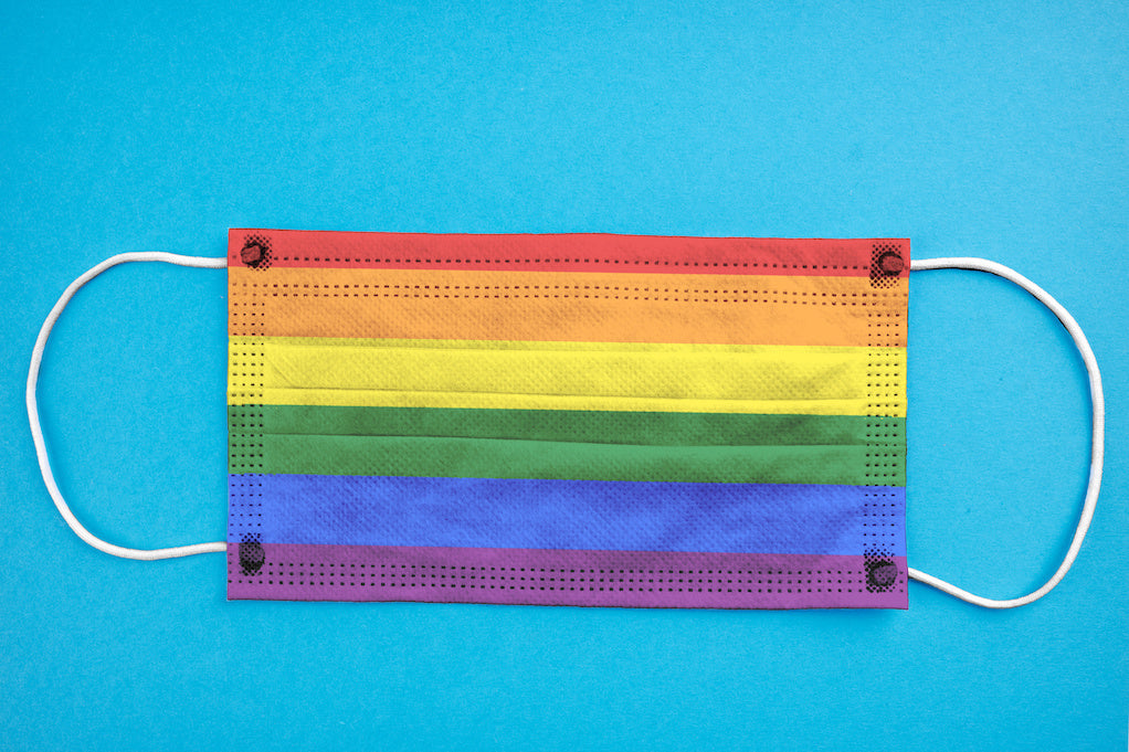 Photo for article on LGBT discrimination in healthcare:  a disposal surgical mask in the new LGBTQIA flag colors