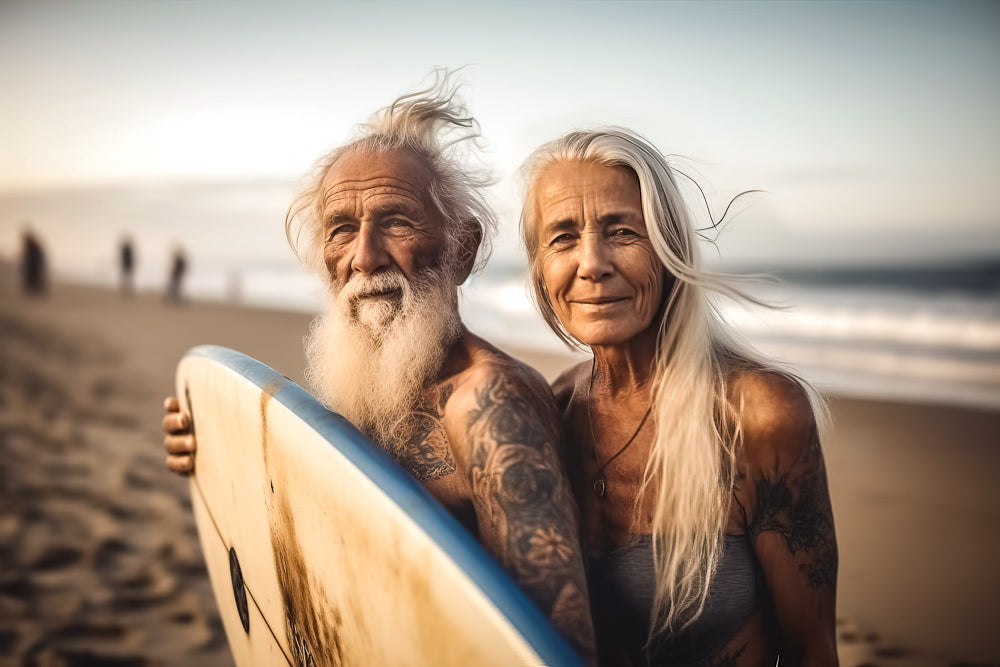 Living for yourself: an AI generate photo of an older couple with tattoos standing on a beach with a surboard. 