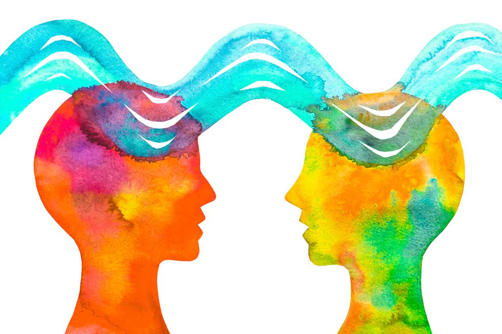 Painted watercolor of the heads of two people communicating telepathically. Communication with thought. Image for URevolution's republishing guidelines.