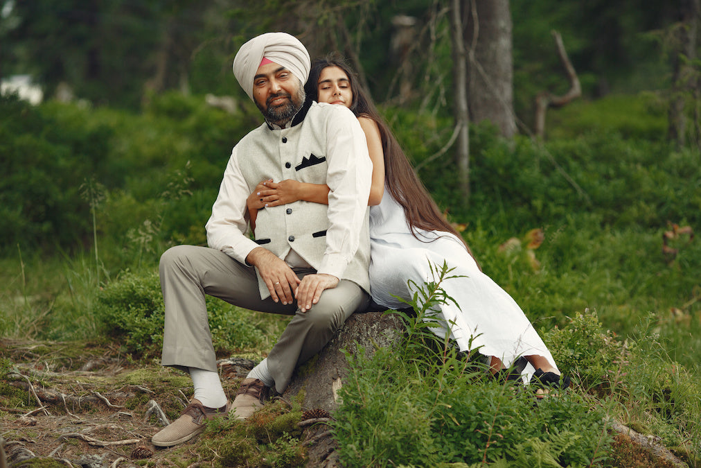 Portrait of Indian Sikh man in turban with daughter