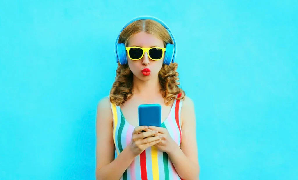 Woman in a swimsuit looking at her phone, representing social anxiety and dating apps.