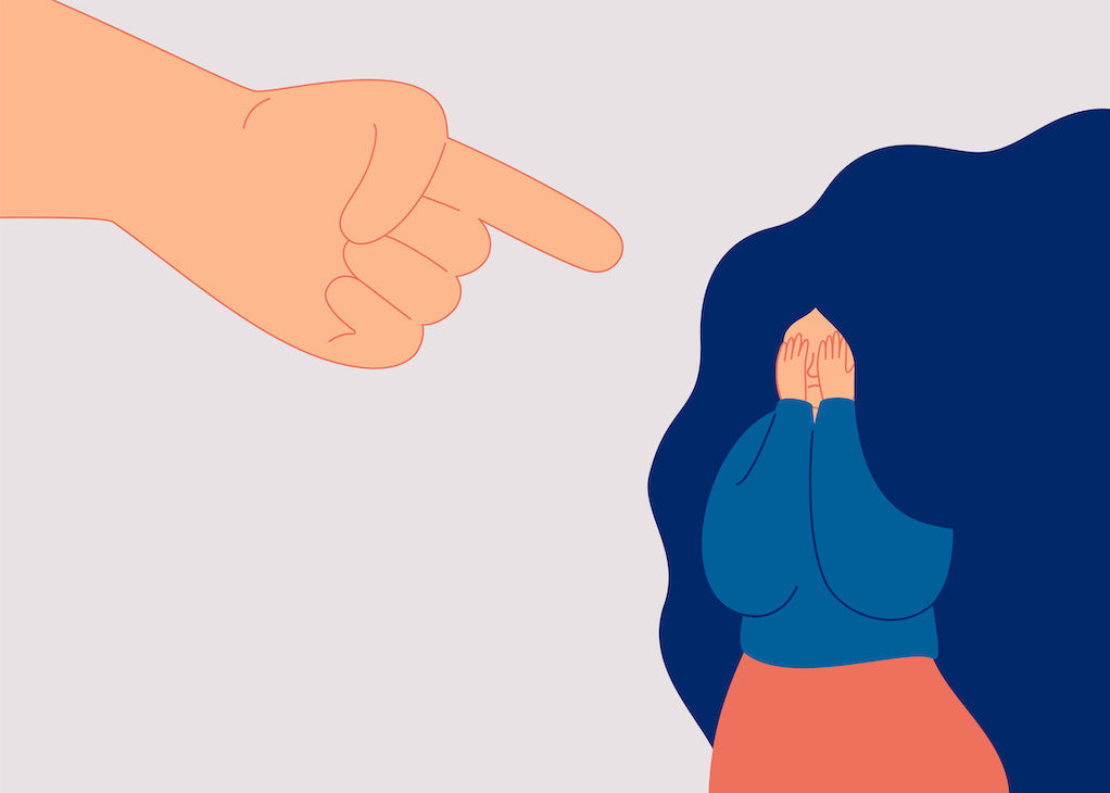 Illustration of a large pointing hand directed at a woman covering her face.