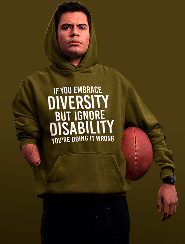 An amputee is wearing a green hoodie with the phrase "If you embrace diversity but ignore disability, you're doing it wrong" printed on it. 
