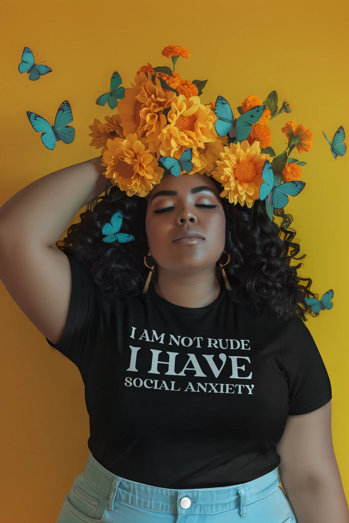 A model wearing a black t-shirt with white text that reads "I Am Not Rude, I Have Social Anxiety." A statement tee for social anxiety awareness