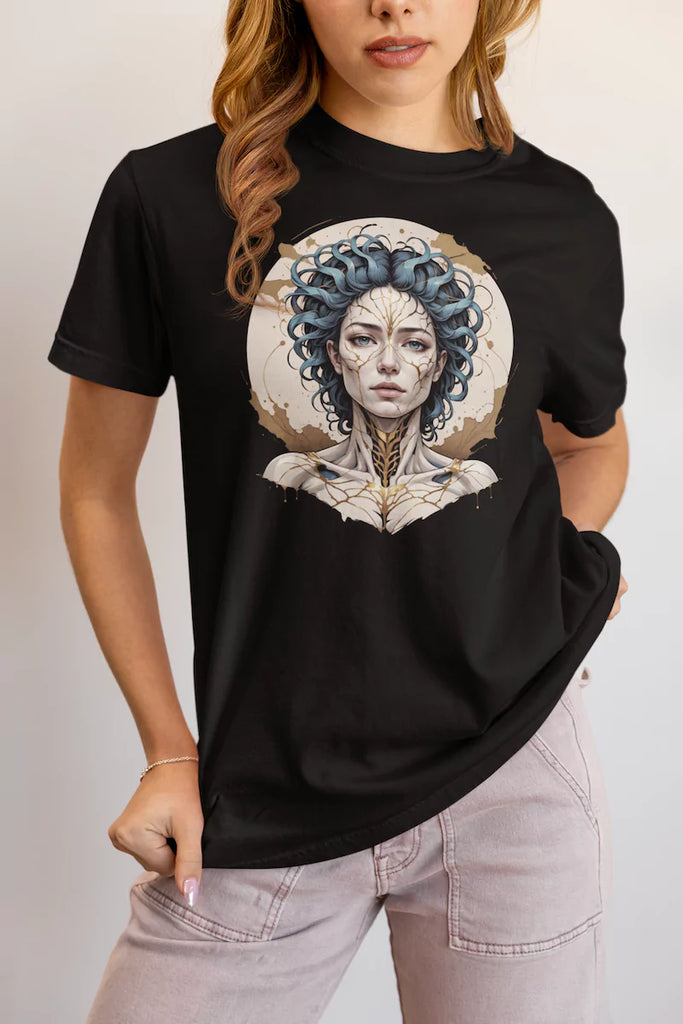 Woman wearing Emotional Alchemy trauma recovery t-shirt, close-up pose showing design on black tee
