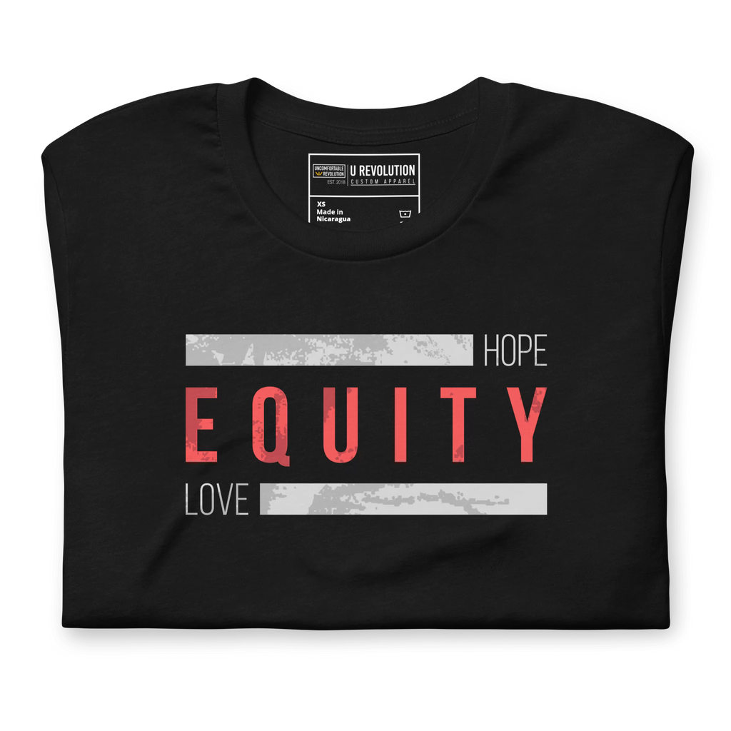 A black folded Equity t-shirt. In the middle top one-third of the equity t-shirt is the word 'Equity' in upper case red letters. Above and below the word are two thick rectangle blocks with a distressed pattern. The word HOPE is printed on the top right-hand side, and the word LOVE is on the bottom left side of the block.