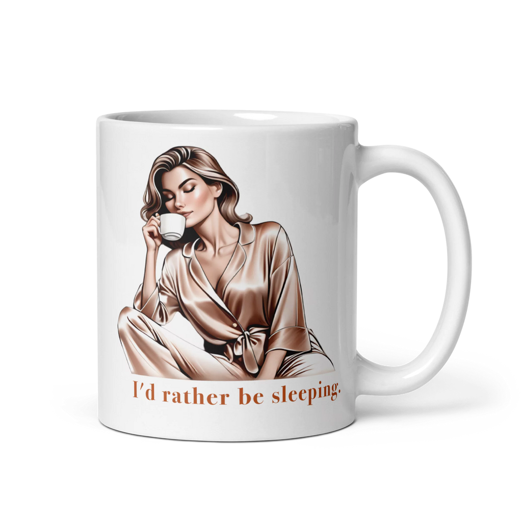 Elegant I'd Rather Be Sleeping Mug 11oz – Left-Handed View. White glossy ceramic mug featuring an elegant woman in silk pajamas drinking coffee.