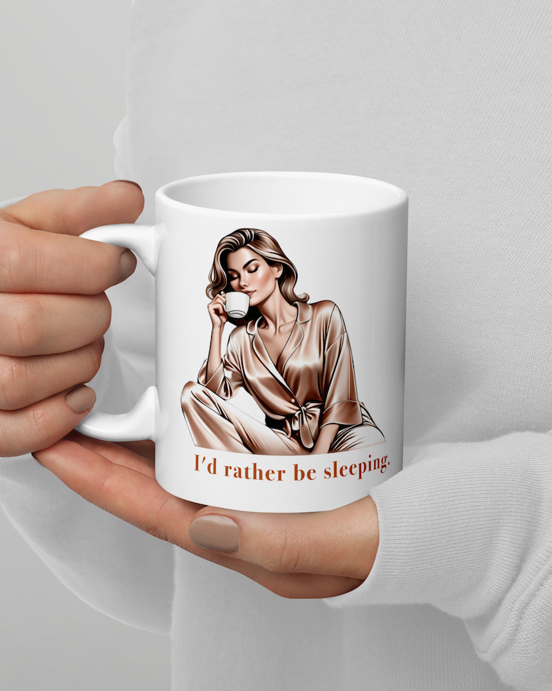 Elegant I'd Rather Be Sleeping Mug 11oz – Right-Handed View. White glossy ceramic mug featuring an elegant woman in silk pajamas drinking coffee.