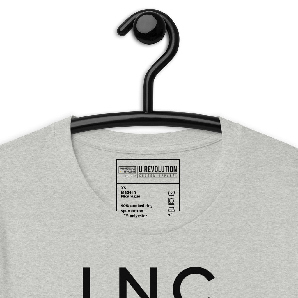 Close-up of the athletic heather INCLUSIVE Statement Tee typography – bold and minimalist lettering arranged in three-line format, representing diversity and inclusion.
