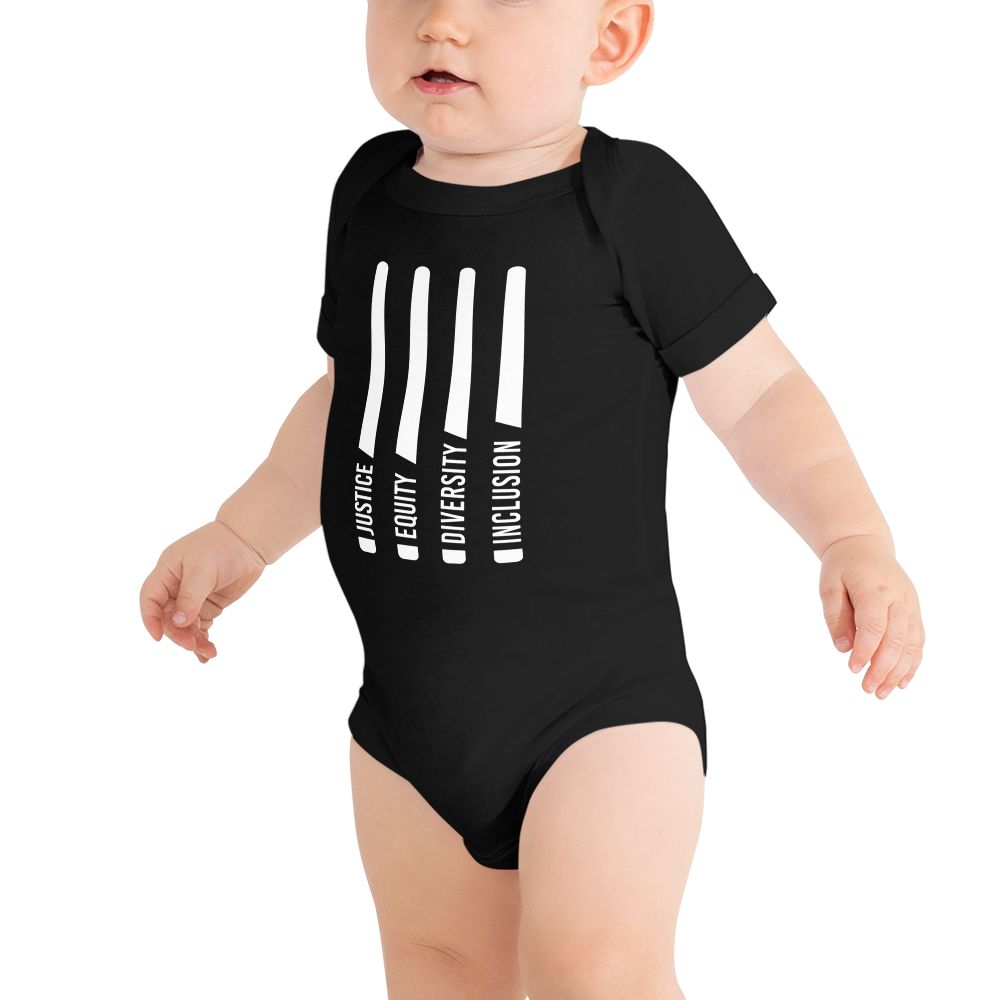 A standing baby. This is a photo of a black JEDI onesie. A photo of a JEDI onesie.A photo of a JEDI onesie. In the middle of the short sleeve, JEDI onesie are four white lightsabers. At the bottom of each saber representing the saber handle is one word: Justice Equity Diversity Inclusion. Beneath the sabers is the acronym JEDI in white upper case letters.
