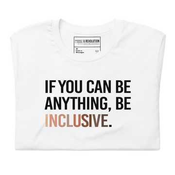 A photo of a white Be Inclusive t-shirt promoting racial diversity. On the front of the inclusive t-shirt is the phrase: "If you can be anything, be inclusive," in black upper case letters. The text is all black, except the word "Inclusive," which is in different skin colors, with the lightest color on the left and the darkest on the right. The shirt is folded.