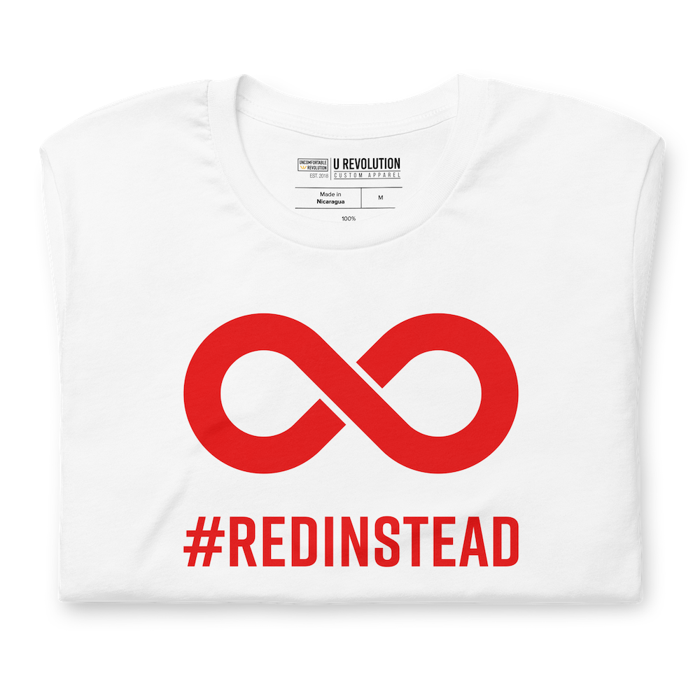 Folded Red Instead t-shirt. In the top one-third of the white shirt is a thick bold red infinity symbol. Directly under the symbol in upper case letters is the word #REDINSTEAD