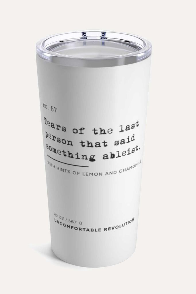 The ableist tears tumbler is white, with black text that reads: "no. 57. Tears of the last person that said something ableist. With hints of lemon and chamomile."