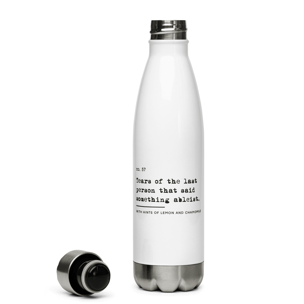 This is a photo of the front of URevolution's Ableist Tears water bottle. On the water bottle is a graphic of URevolution's original phrase; '"Tears of the last person that said something ableist." The phrase is written in lower case, black typewriter font, over three lines. Beneath the phrase, written in a smaller font, is: "With hints of lemon and chamomile."