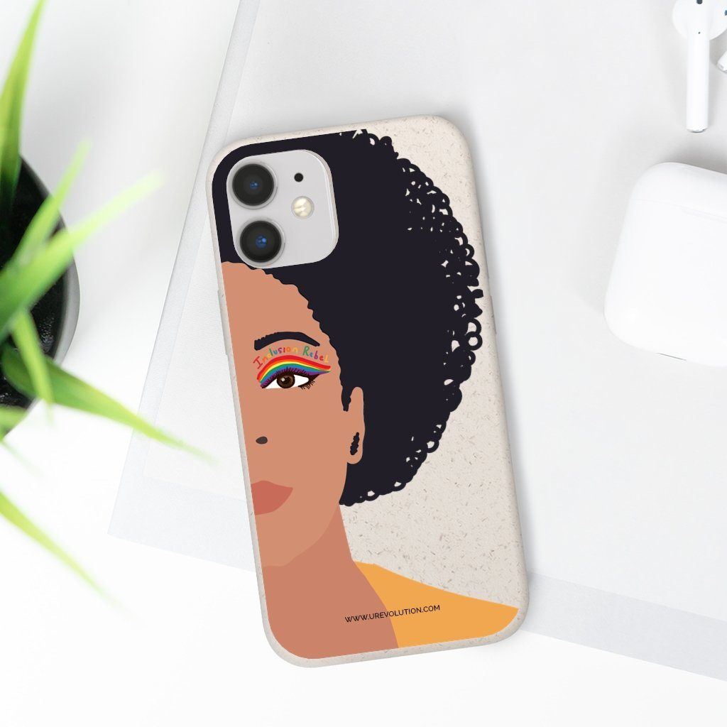 iPhone 12 Inclusion Rebel Afro Phone Case. Printed on the back of the biodegradable phone case is an illustration of the right-hand half of a black person's face. They have a full afro and have a colorful eyeliner design above their right eye. The design includes a series of lines drawn in the colors of the LGTB flag with the words, Inclusion Rebel, outlined in a handwriting style above the lines.
