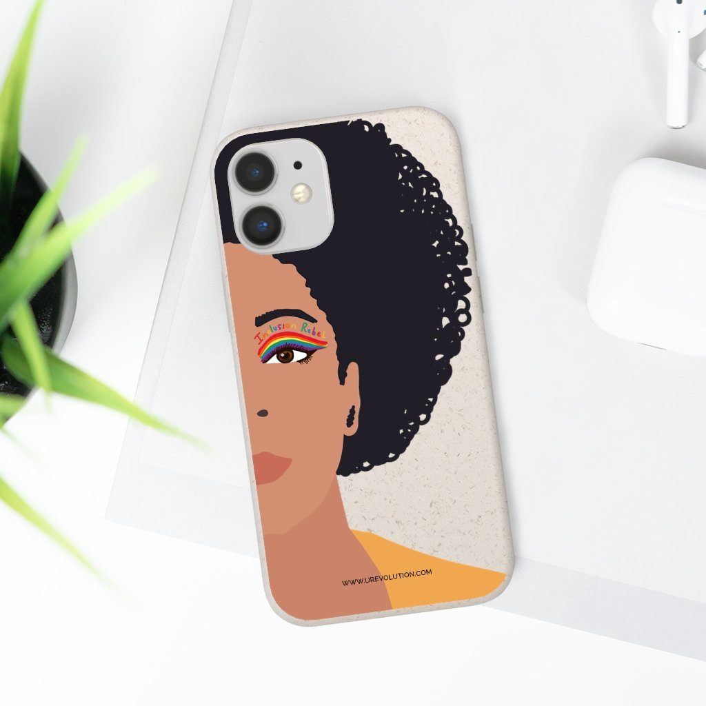 iPhone 12 mini Inclusion Rebel Afro Phone Case. Printed on the back of the biodegradable phone case is an illustration of the right-hand half of a black person's face. They have a full afro and have a colorful eyeliner design above their right eye. The design includes a series of lines drawn in the colors of the LGTB flag with the words, Inclusion Rebel, outlined in a handwriting style above the lines.