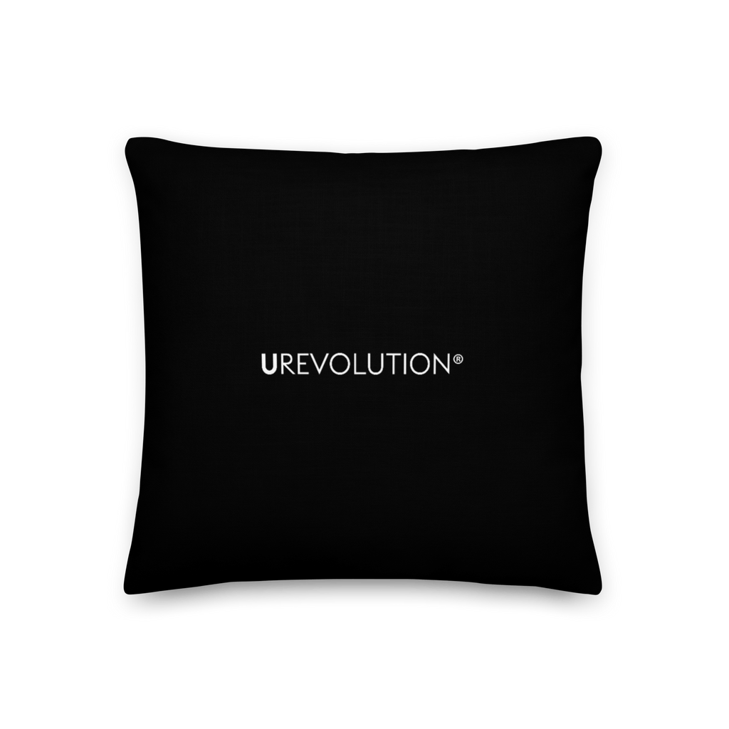 This is an image of the back of a black premium Be Inclusive throw cushion. In the middle of the square throw cushion, the word 'URevolution' is printed in small white upper case letters.