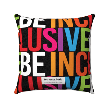 Be Inclusive Faux Suede Pillow-Home Decor-14" x 14"-Uncomfortable Revolution-The words BE INCLUSIVE are printed in huge caps. Be is in white, and Inclusive is in rainbow colors. The words repeat to form an all-over print. A small white tag with "For every body www.urevolution.com" printed in black text is at the bottom center of the back side of the pillow.  Edit alt text