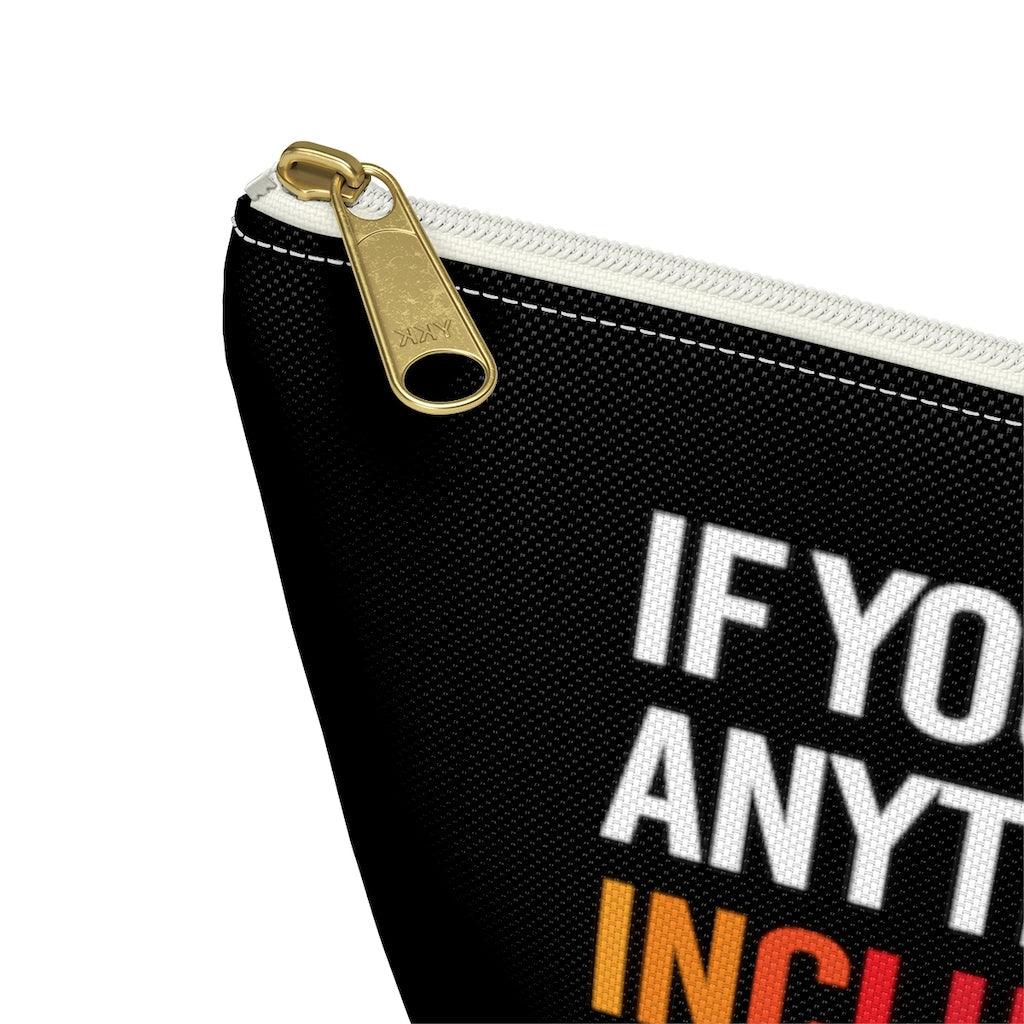 A close up of the corner of the black diversity and inclusion pouch showing the gold zip slider with a white zipper tape.
