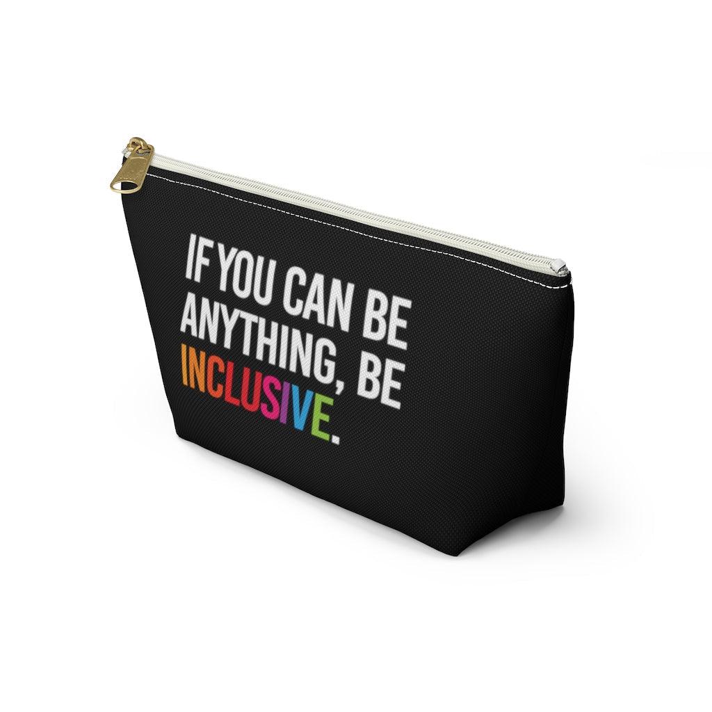 The Be Inclusive pouch is black and has text printed in large all caps, taking up most of the front surface area: "IF YOU CAN BE ANYTHING, BE INCLUSIVE." All text is in white, except "Inclusive" which is in rainbow colors. The pouch has a white zip and gold closure.