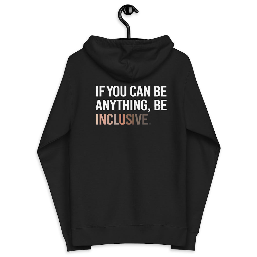The back of a black Be Inclusive Diversity Zip Up Hoodie. On the back of the inclusive diversity hoodie is the phrase: "If you can be anything, be inclusive," in upper case letters. The text is all white, except the word "Inclusive," which is in different skin colors, with the lightest shade on the left and the darkest on the right. The hoodie is on a hanger.