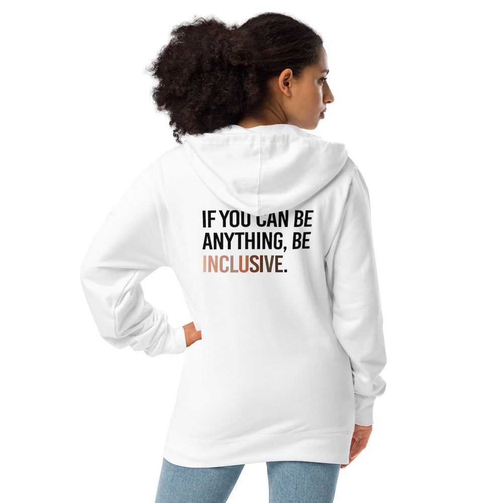 The back of a white Be Inclusive Diversity Zip Up Hoodie. On the back of the inclusive diversity hoodie is the phrase: "If you can be anything, be inclusive," in upper case letters. The text is all black, except the word "Inclusive," which is in different skin colors, with the lightest shade on the left and the darkest on the right. The hoodie is worn by a female model.