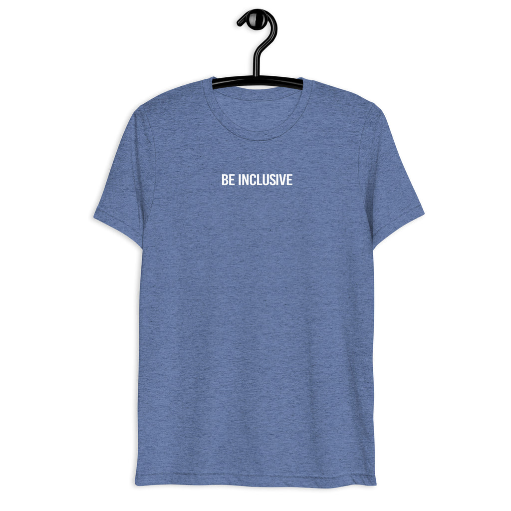 Blue unisex tri-blend Be Inclusive t-shirt. Printed in the middle top one-third of the t-shirt in white upper case letters, about one inch high is the phrase - Be Inclusive. The t-shirt is hanging on a black plastic hanger against a blank wall.