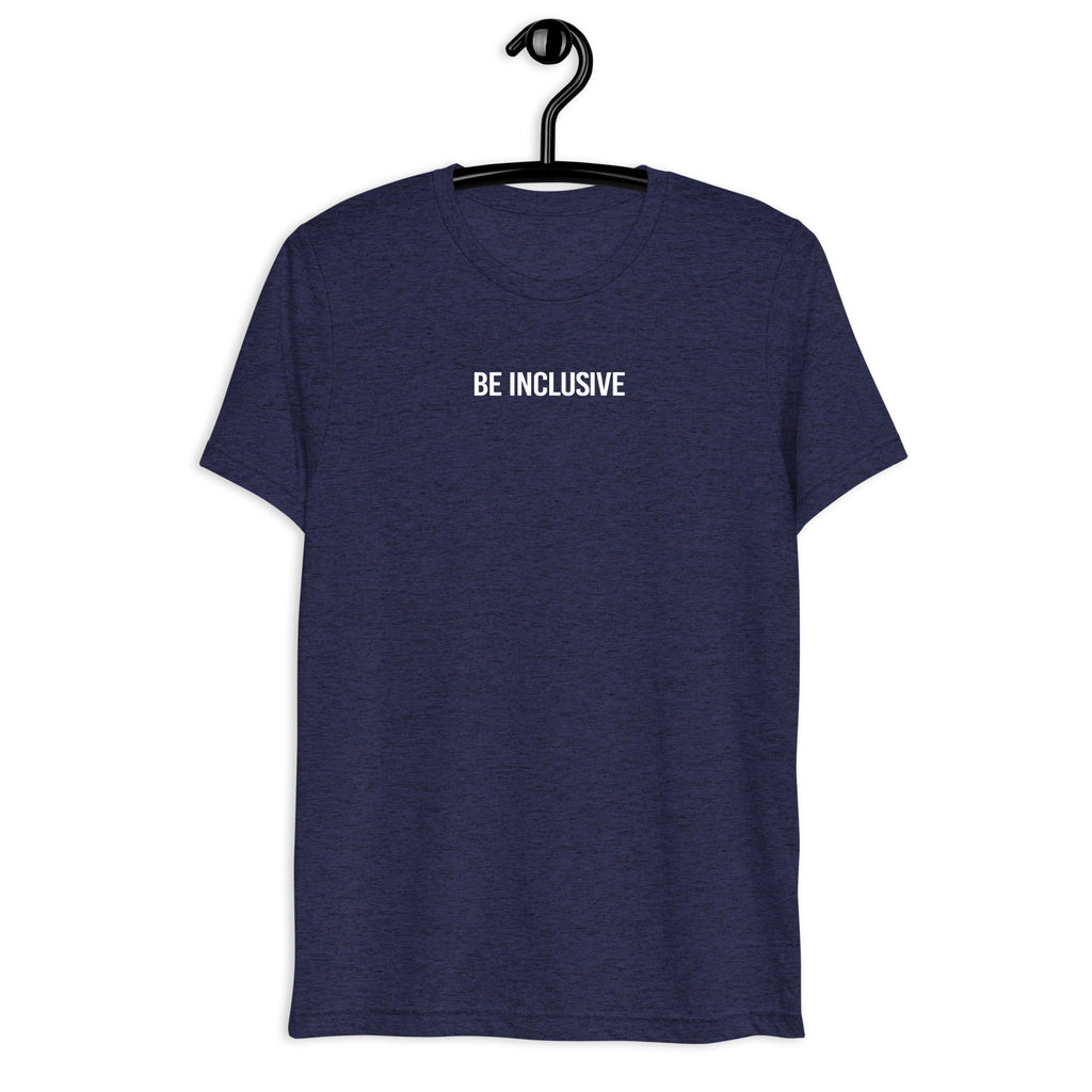 Navy unisex tri-blend Be Inclusive t-shirt. Printed in the middle top one-third of the t-shirt in white upper case letters, about one inch high is the phrase - Be Inclusive. The t-shirt is hanging on a black plastic hanger against a blank wall.