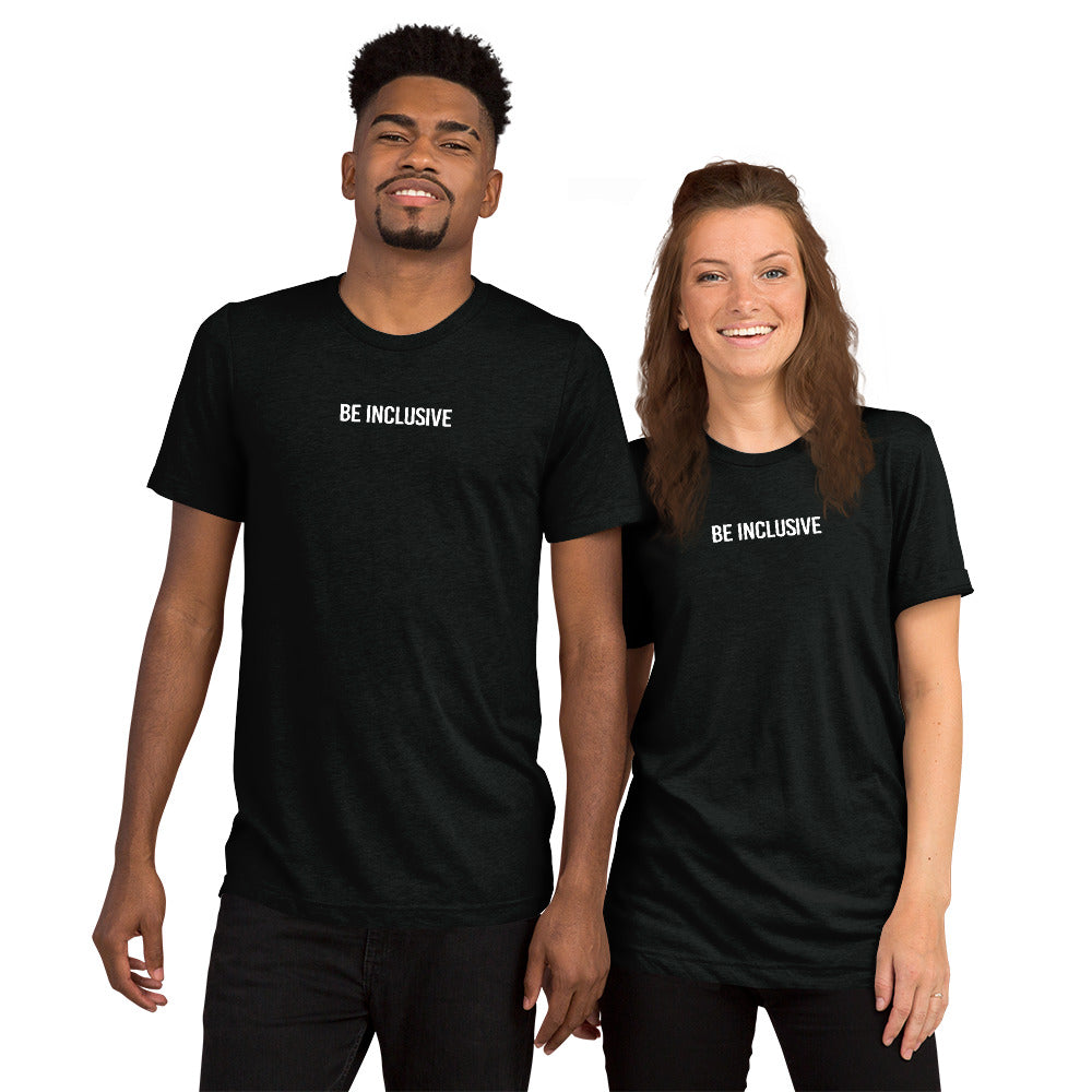This is a photo of a unisex tri-blend Be Inclusive t-shirt worn by two models: one male, and one female. Printed in the middle top one-third of the t-shirt in white upper case letters, about one inch high is the phrase - Be Inclusive. 