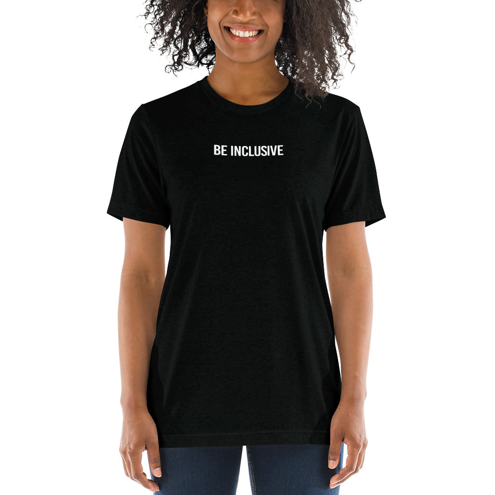 This is a photo of a unisex tri-blend Be Inclusive t-shirt worn by a model. Printed in the middle top one-third of the t-shirt in white upper case letters, about one inch high is the phrase - Be Inclusive. 