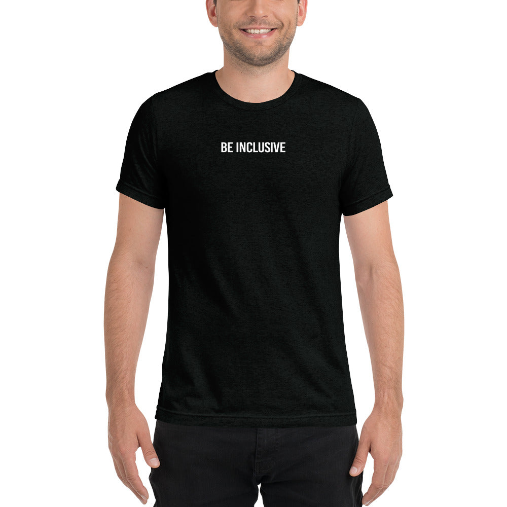 This is a photo of a unisex tri-blend Be Inclusive t-shirt worn by a model. Printed in the middle top one-third of the t-shirt in white upper case letters, about one inch high is the phrase - Be Inclusive. 