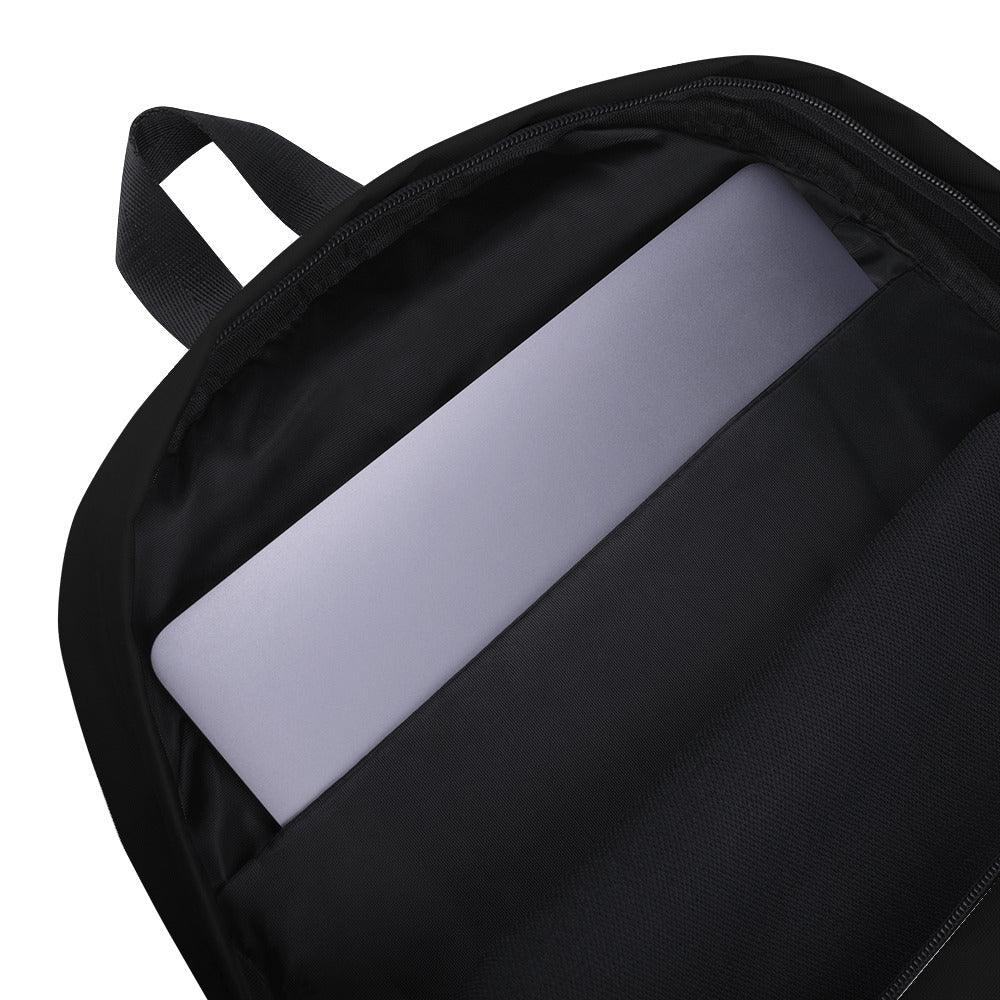 A close up of the inside of the black back-pack showing a laptop inside an inner laptop pocket. 