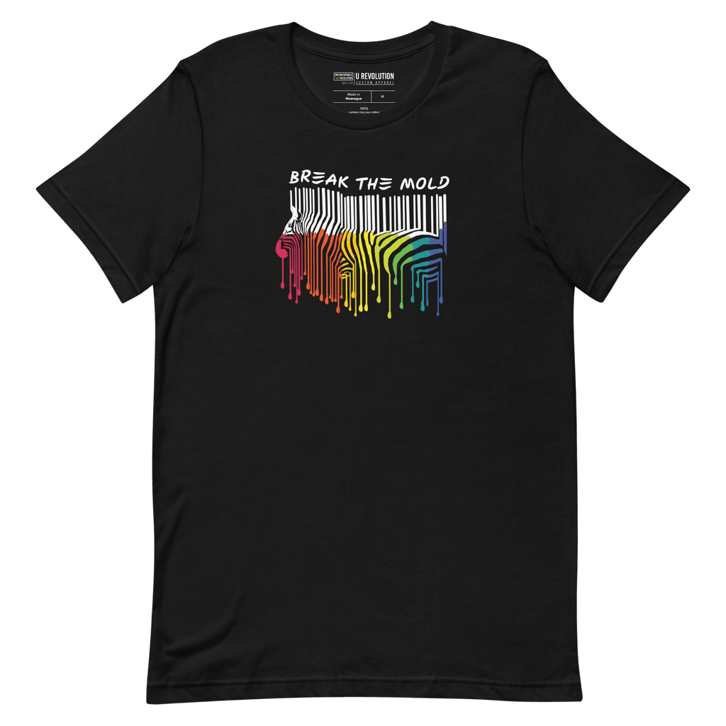 This is a photo of a Break the Mold t-shirt. In the middle of the t-shirt is a graphic of zebra in the silhouette of a barcode. The top half of the zebra are vertical white stripes, which then change just below the back into the colors of the rainbow. The bottom of each stripe has a paint drip mark. Just above the zebra's back is the phrase, in upper case, 'break the mold.' 