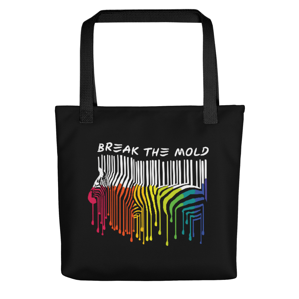 An image of a black tote bag against a plain background. In the middle of the bag is a graphic of zebra in the silhouette of a barcode. The top half of the zebra are vertical white stripes, which then change just below the back into the colours of the rainbow. The bottom of each stripe has a paint drip mark. Just above the zebra's back is the phrase, in upper case, 'break the mold.'
