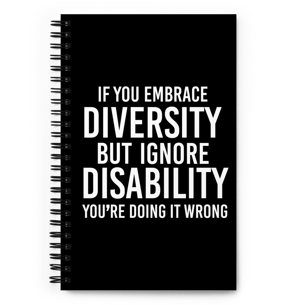 Front cover of URevolution's spiral-bound black Embrace Diversity notebook. The cover features URevolution's original Embrace Diversity phrase printed in white on a black background: "If you embrace diversity but ignore disability, you're doing it wrong."