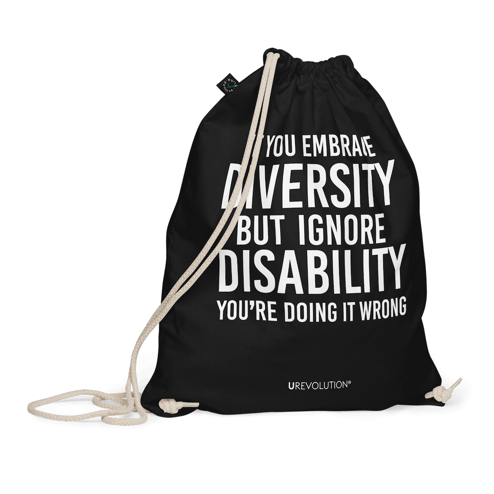 A black Embrace Diversity organic cotton drawstring bag. The middle of the drawstring bag features the phrase, printed in large white upper case letters, "If you embrace diversity but ignore disability, you're doing it wrong." The phrase fills 80% of the bag. 